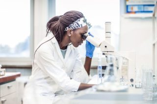 female dermatologist studing a biopsy