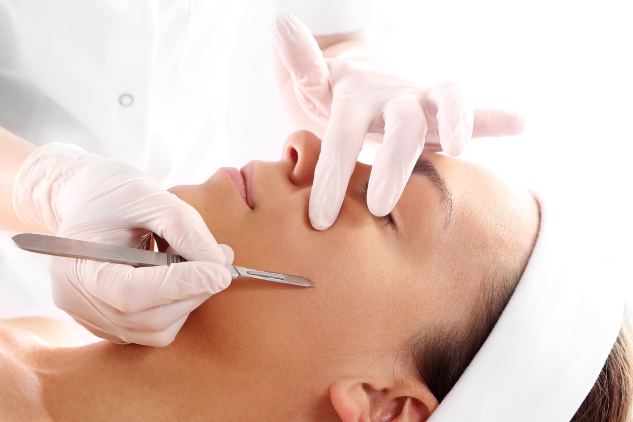 Woman receiving dermaplaning treatments