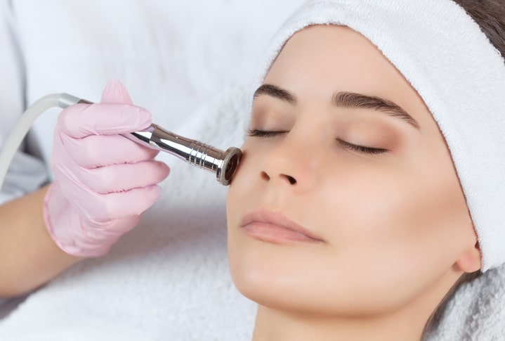 Woman receiving microdermabrasion